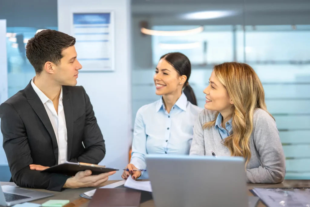 Business partners discuss refinancing their commercial loan with their professional commercial broker